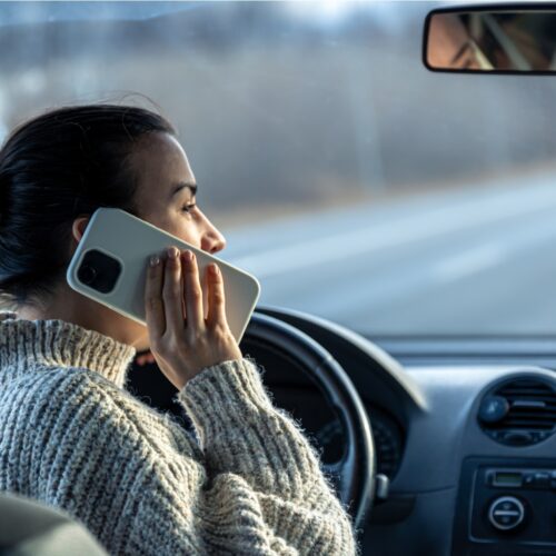 Distracted driver talking on smartphone