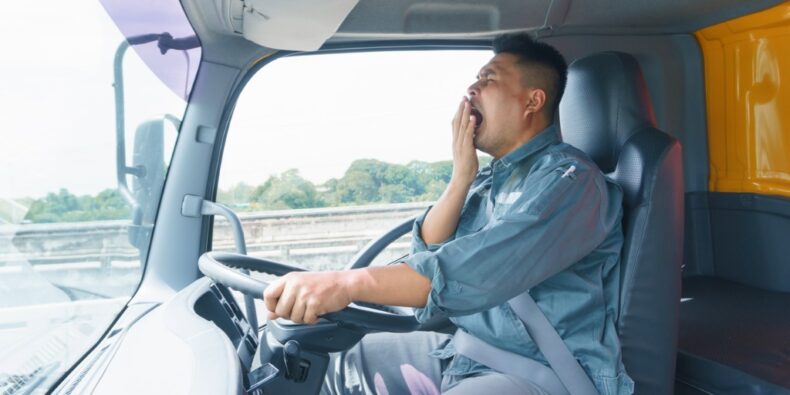 Fatigued driving, truck driver yawning